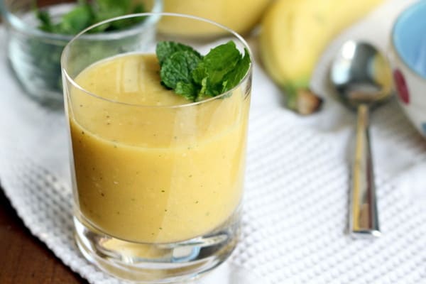 Mango-Coconut Water Smoothie in a small clear glass