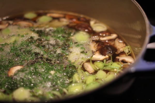 vegetable broth simmering in a stockpot